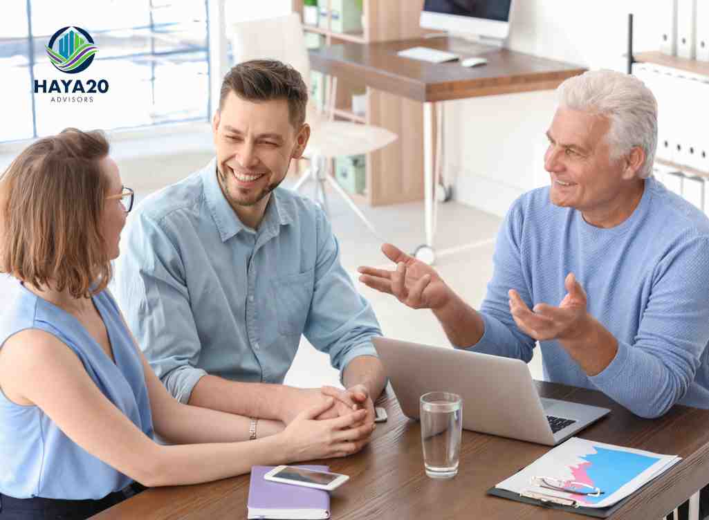A family discussing legacy planning and insurance with a financial advisor around a table.