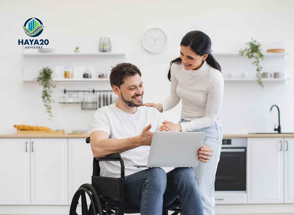 Couple discussing financial planning with a laptop and disability support needs.