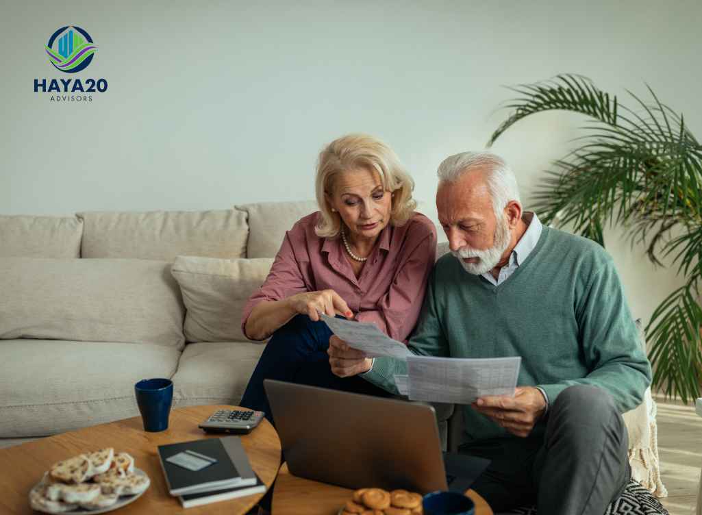 Retired couple reviewing financial documents and planning required minimum distributions.